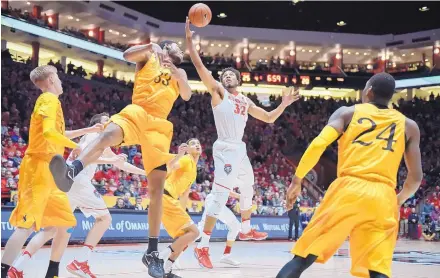 ?? ROBERTO E. ROSALES/JOURNAL ?? New Mexico’s Tim Williams (32), shown grabbing a rebound on Jan. 21 against Wyoming, has been trying to play with a stress reaction in his left foot. But on Tuesday, the school said the Lobo senior must be shut down for an indefinite amount of time.