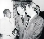  ??  ?? A HANDSHAKE for newspaper editor Michael Green from Robert Mugabe. The photograph was taken in Harare in 1982 when the Zimbabwean leader was generally regarded as a bright hope for the future. On the right is Harvey Tyson, former editor of The Star.