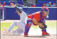  ?? The Associated Press ?? Jon Blacker
Isiah Kiner-Falefa scores behind Blue Jays catcher Alejandro Kirk on Aaron Hicks’ threerun double during the fourth inning of the Yankees’ 4-0 win Saturday at Rogers Centre.