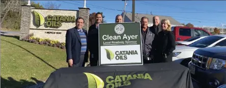  ?? Courtesy catania oils ?? showing off a new sign are ayer town manager robert pontbriand, catania oils executive vice president of sales and marketing stephen basile, catania oils president Joseph basile, ceo anthony basile, ayer director of community and economic developmen­t alan manoian and catania oils vice president of Human resources annemarie abdo.