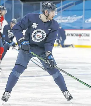  ?? POSTMEDIA NEWS ?? Pierre-Luc Dubois takes part in a Winnipeg Jets practice on Sunday.