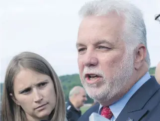  ?? JACQUES BOISSINOT/THE CANADIAN PRESS ?? Premier Philippe Couillard said Friday that the religious neutrality law will apply throughout the province and “it’s the prerogativ­e of the Quebec government to do that.”