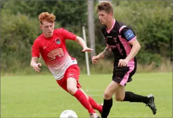  ??  ?? Owen McCormack of Wexford Youths battling with Alex Byrne (Cork City).