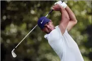  ?? THE ASSOCIATED PRESS ?? Brooks Koepka hits from the tee on the third hole during second-round play in the Tour Championsh­ip.