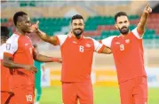  ??  ?? Dhofar’s Oudi al Qara (right) celebrates with his teammates after scoring