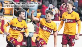  ?? ?? Too little, too late Shane Blaney, centre, celebrates his equaliser