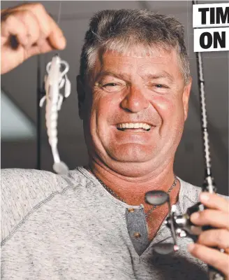  ?? Picture: ALIX SWEENEY ?? PERFECT CATCH: Fishing Warehouse’s Dave Hodge with a soft lure ideal for tempting barramundi.