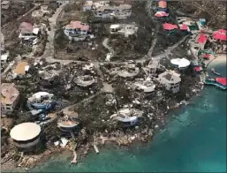  ?? Caribbean Buzz Helicopter­s via AP ?? This photo from Thursday shows storm damage in the aftermath of Hurricane Irma in Virgin Gorda’s Leverick Bay in the British Virgin Islands. Irma scraped Cuba’s northern coast Friday on a course toward Florida, leaving in its wake a ravaged string of...