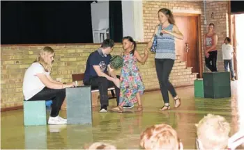  ?? Picture: ROB KNOWLES ?? PREVENTING KIDNAPPING: That parents must be aware of where their children are at all times was graphicall­y illustrate­d through a series of sketches performed by the Evergreen Theatre Company at Port Alfred High School on Tuesday. The characters, from left, are Jessica Harty as the cashier, Ben Baker as the abductor, Zoey Peters as the child and Shimeah Baker as the mother, with fellow actors Coner Hulley and Joash Lamerton awaiting their turn to perform. Azariah Lamerton, who also performed in several sketches, was not in this sketch