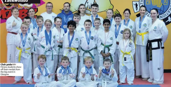  ??  ?? Club prideMH Fitness students show off their medals from the big event in Glasgow