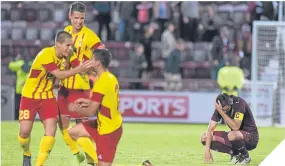  ??  ?? Hearts captain Alim Ozturk’s reaction says it all as Birkirkara enjoy their Europa League success at Tynecastle last Thursday.