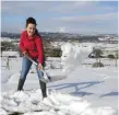  ??  ?? Ali Keogh clears snow in Co Wicklow in the last cold snap