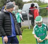  ??  ?? Hurling advice for a young player.