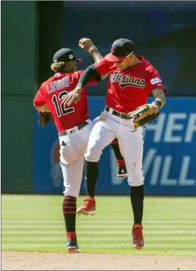  ?? PHIL LONG — THE ASSOCIATED PRESS ?? The Indians’ Francisco Lindor and Oscar Mercado celebrate their win over the Angels on Aug. 4 at Progressiv­e Field.