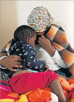  ?? Picture: SIBONGILE NGALWA ?? SHATTERED: Siphokazi Ntyapa mourns the death of her husband, who was shot and killed in front of their two-year-old grandson Lusenathi Mputha on the Gonubie Main Road on Saturday