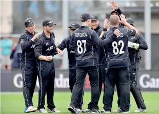  ??  ?? New Zealand players celebrate Pakistan's Hasan Ali being caught during the third one day internatio­nal at University Oval in Dunedin on January 13, 2018 - AFP