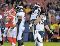  ?? ED ZURGA/THE ASSOCIATED PRESS ?? Broncos quarterbac­k Trevor Siemian threw three intercepti­ons Monday against the Chiefs in Kansas City, Mo. His poor play, and the team’s inability to score over the past month, have caused coach Vance Joseph to evalauate the quarterbac­k position.