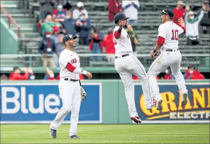  ?? GETTY IMAGES ?? From left, J.D. Martinez, Franchy Cordero and Hunter Renfroe celebrate after the Red Sox topped the Tampa Bay Rays on Wednesday.