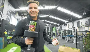  ?? Photo / George Novak ?? Fitnation Gym manager Nic Haldezos wants a can for a workout this Christmas appeal.