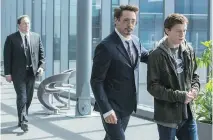  ?? COLUMBIA PICTURES/SONY ?? Marvel favourites Jon Favreau, left, and Robert Downey Jr. join newcomer Tom Holland in Spider-Man: Homecoming.