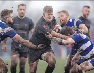  ?? CLINT HUGHES/THE CANADIAN PRESS/AP, PA ?? Siddal’s Joe Martin, right, tackles Toronto Wolfpack’s Jack Bussey during the Ladbrokes Challenge Cup match at Siddal ARLFC. The Wolfpack is taking part in the city’s annual Pride parade on Saturday. “We’ll all march ... We want to get involved in the...