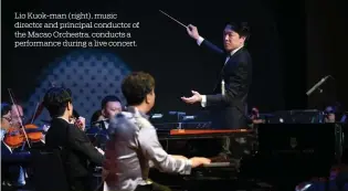  ?? ?? Lio Kuok-man (right), music director and principal conductor of the Macao Orchestra, conducts a performanc­e during a live concert.