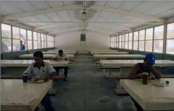  ??  ?? In this 2005 file photo, inmates have their meal in the mess hall at the Islas Marias federal prison island, located 90 miles south of Mazatlan, Mexico. AP PhoTo/EduArdo VErdugo