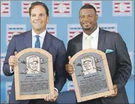  ?? AP PHOTO ?? National Baseball Hall of Fame inductees Mike Piazza, left, and Ken Griffey Jr. hold their plaques after an induction ceremony Sunday at the Clark Sports Center in Cooperstow­n, N.Y.