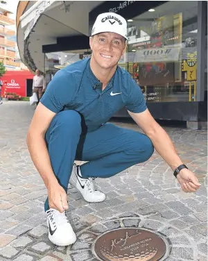  ?? Picture: Getty Images. ?? Alex Noren of Sweden places a plaque in the paving stones to mark his victory last year at Crans-sur-Sierre.