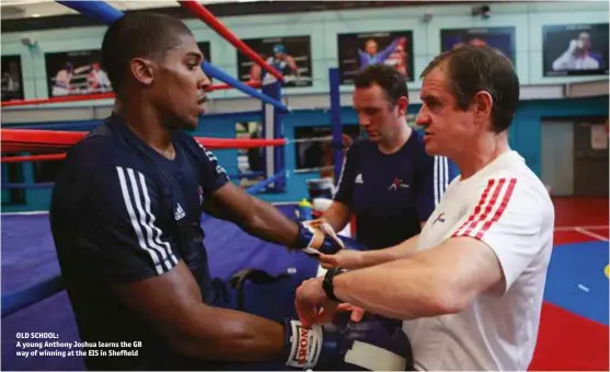  ?? Photos: GB BOXING ?? OLD SCHOOL: A young Anthony Joshua learns the GB way of winning at the EIS in Shef eld