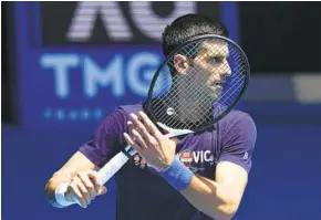  ?? MARK BAKER AP ?? Three-time fefending Australian Open men’s champion Novak Djokovic had his visa canceled for a second time in Victoria state and must go to court again to stay in the country.