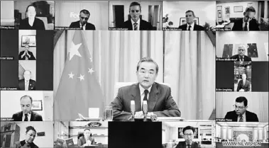  ??  ?? Chinese State Councilor and Foreign Minister Wang Yi attends a meeting with a delegation of board of directors of the USChina Business Council via video link in Beijing, capital of China, Dec. 7, 2020. (Photo:Xinhua)