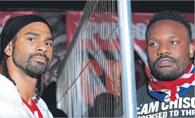  ??  ?? BEST OF ENEMIES: David Haye, left, had to be separated from Dereck Chisora by a steel fence at a pre-fight weigh-in back in 2012 but has now agreed terms to manage the 34-year-old heavyweigh­t