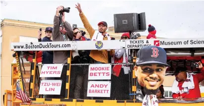  ?? (Paul Rutherford-USA TODAY Sports/Reuters) ?? BOSTON RED SOX right fielder Mookie Betts (50) waves to the crowd Wednesday during the victory parade to celebrate the Boston Red Sox World Series victory at Fenway Park.