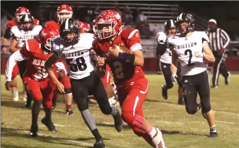  ?? The Sentinel-Record/Richard Rasmussen ?? SENIOR LEADER: Mountain Pine senior quarterbac­k Collin Smith (4) rushes down the field for a touchdown in Friday’s 60-42 win over Bigelow at Stanley May Field. Smith had 26 carries for 351 yards and rushed for seven touchdowns while throwing for the other.