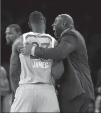  ?? The Associated Press ?? IT’S MAGIC: Magic Johnson, right, talking with LeBron James (23) at the NBA All-Star game Sunday, is named director of basketball operations for the Los Angeles Lakers.