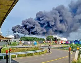  ?? — AP ?? A dark cloud of smoke rises above the chemical park in Leverkusen, Germany, on Tuesday.