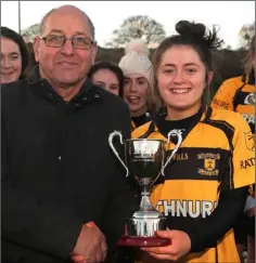  ??  ?? Ashlynn O’Leary receives the cup from Ger Redmond.