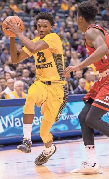  ?? JEFF HANISCH / USA TODAY SPORTS ?? Marquette guard Jajuan Johnson gets a step on Saint Francis’ Randall Gaskins Jr. for two of his 11 points on Monday.