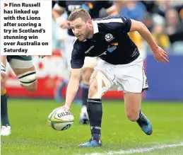  ??  ?? > Finn Russell has linked up with the Lions after scoring a try in Scotland’s stunning win over Australia on Saturday