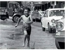  ?? STUFF ?? Six-year-old Darren Crouse charges through a pool of water in Cathedral Square on February 5, 1973 as temperatur­es rose before the 42.4C record-breaker.