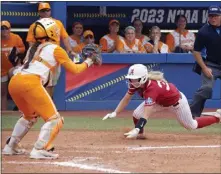  ?? NATE BILLINGS – THE ASSOCIATED PRESS ?? Alabama's Ally Shipman slides home to score as Tennessee's Giulia Koutsoyano­pulos waits for the throw during Thursday's game.