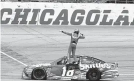  ?? NAM Y. HUH/ASSOCIATED PRESS ?? Kyle Busch celebrates after winning at Chicagolan­d Speedway, his fifth Cup Series victory of the season.