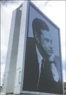  ?? JILL LAWLESS/THE ASSOCIATED PRESS ?? A billboard Thursday showing the late Beatles manager Britain Epstein is part of a festival in Liverpool, England, celebratin­g the 50th anniversar­y of the Beatles album Sgt. Pepper’s Lonely Hearts Club Band.