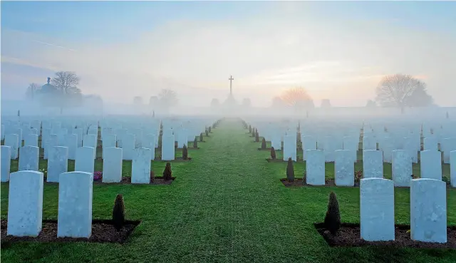  ?? BART HEIRWEG/VISITFLAND­ERS ?? A lingering mist at Tyne Cot Cemetery in Flanders Fields which has 520 New Zealand graves, 322 unidentifi­ed. There is a memorial commemorat­ing 1176 New Zealanders who have no known grave.