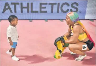  ??  ?? Jamaica's Shelly-ann Fraser-pryce celebrates winning World Championsh­ips 100m gold with her son in Doha on Monday. (Below) Allyson Felix, who won gold in 400m mixed relay. REUTERS