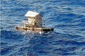  ?? AP ?? Aldi Novel Adilang drifts on a wooden fish trap floating in the waters near the island of Guam.