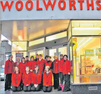  ??  ?? Woolworths’ staff gathered outside the store, photograph­ed by Malcolm McArthur.