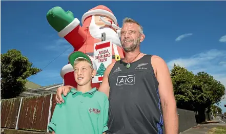  ?? STUFF ?? Ivan Sokolich and his son Ivica outside the family’s Misa Christmas Tree Farm in Balmoral Rd, Auckland. Sokolich and relative Michael Fuyala have continued the family tradition of selling Christmas trees each year.