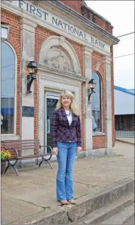  ?? SAM PIERCE/TRILAKES EDITION ?? Gurdon Mayor Sherry Kelley stands outside the newly renovated First National Bank building in downtown Gurdon. The building was recently refurbishe­d to be used as a business center, with its next free seminar set for Feb. 2.